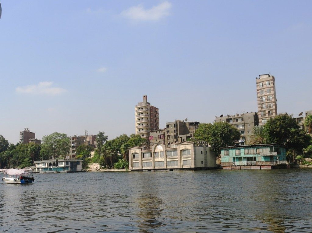 House-boats on the Nile in Imbāba; residential houses, wedding halls, restaurants, and simple, quiet hotels (Tadamun, 2015)