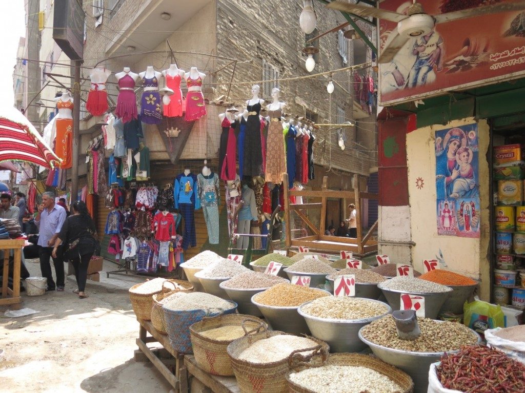 Shops and mobile as well as fixed commercial activities, are landmarks for many of the main streets of al Munīra al-Gharbiyya. The picture is from al-Baṣrāwī Street. (Tadamun, 2015)
